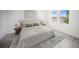 Comfortable bedroom featuring neutral decor, soft lighting, and serene views at 18039 Cherished Loop, Bradenton, FL 34211