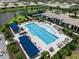 Enjoy the community pool and lounge chairs with ample seating in this aerial image at 18039 Cherished Loop, Bradenton, FL 34211