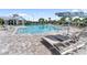 Large community pool with lounge seating and tables at 18039 Cherished Loop, Bradenton, FL 34211