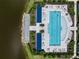 Aerial view of the community pool, featuring ample seating overlooking the lake at 18039 Cherished Loop, Bradenton, FL 34211