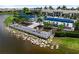 Scenic lakeside deck with seating provides a tranquil space to unwind and enjoy the community pool at 18039 Cherished Loop, Bradenton, FL 34211