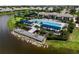 A stunning community pool and lounging area with lake views, perfect for relaxation and recreation at 18039 Cherished Loop, Bradenton, FL 34211