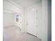 Clean entryway featuring bright white paint, a modern door, and tile floors at 18039 Cherished Loop, Bradenton, FL 34211
