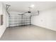 Clean, empty two-car garage with epoxy floor and automatic door opener at 18039 Cherished Loop, Bradenton, FL 34211