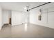 Spacious two-car garage boasting clean epoxy floors and neutral white walls at 18039 Cherished Loop, Bradenton, FL 34211