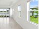 The living room has lots of natural light and views of the lake, creating a serene atmosphere at 18039 Cherished Loop, Bradenton, FL 34211