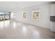 Bright living room with large windows overlooking the lake at 18039 Cherished Loop, Bradenton, FL 34211