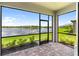 The screened lanai offers serene lake views and a brick-paved patio at 18039 Cherished Loop, Bradenton, FL 34211