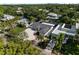Beautiful aerial view of a single-story home with lush landscaping and a pea gravel driveway at 1881 Orchid St, Sarasota, FL 34239
