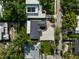 Birds-eye view of a single-story home showcasing its roof, driveway, and green surroundings at 1881 Orchid St, Sarasota, FL 34239