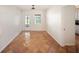 Bright dining room features a door to the backyard, window, and unique tile flooring at 1881 Orchid St, Sarasota, FL 34239
