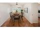 The dining room features new decor, dining furniture, terracotta tile flooring, and lots of light at 1881 Orchid St, Sarasota, FL 34239