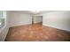 Open concept living room featuring terra cotta tile and access to multiple rooms at 1881 Orchid St, Sarasota, FL 34239