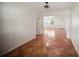 A spacious living room has terra cotta tile flooring and a view into other rooms at 1881 Orchid St, Sarasota, FL 34239
