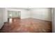 Spacious living room featuring terra cotta tile and access to exterior at 1881 Orchid St, Sarasota, FL 34239