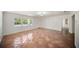 Spacious living room with terra cotta tile and large window for natural light at 1881 Orchid St, Sarasota, FL 34239