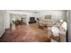 Bright living room featuring terra cotta tile, neutral walls, and dining room access at 1881 Orchid St, Sarasota, FL 34239