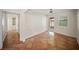 A bright living room has tile floors, access to the backyard, and ample wall space at 1881 Orchid St, Sarasota, FL 34239