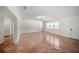 Spacious living room featuring terra cotta tile and access to exterior at 1881 Orchid St, Sarasota, FL 34239