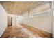 Bright room with wooden ceiling, tile flooring, and glass block windows for privacy and light at 1881 Orchid St, Sarasota, FL 34239