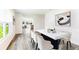 Bright dining room with modern table, chairs, stylish rug, and view to living area at 1914 Cobb Trl, Parrish, FL 34219
