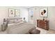 Comfortable bedroom featuring neutral tones, decorative wall art, and natural light from a window at 1922 Cobb Trl, Parrish, FL 34219