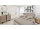 Comfortable bedroom with neutral walls, carpet, and a large window offering plenty of natural light at 1922 Cobb Trl, Parrish, FL 34219