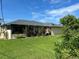 Well-maintained backyard with lush green grass and mature landscaping at 19358 Edgewater Dr, Port Charlotte, FL 33948