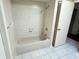 Bathroom with a tub and tiled walls at 19358 Edgewater Dr, Port Charlotte, FL 33948