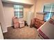 Bedroom with window and loaded with boxes at 19358 Edgewater Dr, Port Charlotte, FL 33948