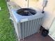 Exterior shot of the Champion brand AC unit on the side of the house at 19358 Edgewater Dr, Port Charlotte, FL 33948