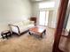 Bright living room featuring a traditional sofa, unique coffee table, and sliding glass door at 19358 Edgewater Dr, Port Charlotte, FL 33948