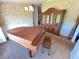 Cozy living room features a piano and a large decorative cabinet at 19358 Edgewater Dr, Port Charlotte, FL 33948