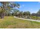 Picturesque community garden surrounded by a black metal fence and mature trees at 2115 9Th W Ave # 3D, Bradenton, FL 34205