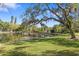 Picturesque community pier on tranquil lake surrounded by lush greenery and trees at 2115 9Th W Ave # 3D, Bradenton, FL 34205