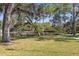 Picturesque community pier on serene lake surrounded by lush greenery and trees at 2115 9Th W Ave # 3D, Bradenton, FL 34205