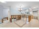 Open-concept dining room leading into kitchen shows the space with exposed framing and tiled floors at 2115 9Th W Ave # 3D, Bradenton, FL 34205