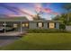 Charming single-story home with a covered carport, well-kept lawn, and inviting curb appeal at 2115 9Th W Ave # 3D, Bradenton, FL 34205