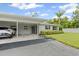 Inviting home with covered parking, well-manicured front lawn, and attractive exterior at 2115 9Th W Ave # 3D, Bradenton, FL 34205