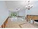 Bright living room with decorative tiled floors and sliding glass doors leading to the outdoors at 2115 9Th W Ave # 3D, Bradenton, FL 34205