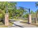 Scenic entrance to John & Rebecca Neal Park with a brick pillar archway at 2115 9Th W Ave # 3D, Bradenton, FL 34205