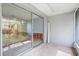 Covered brick patio showcasing large sliding glass doors to interior room and view of outdoors at 2115 9Th W Ave # 3D, Bradenton, FL 34205