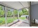 Enclosed porch offering outdoor views of the backyard and the tranquil waterway beyond at 2115 9Th W Ave # 3D, Bradenton, FL 34205