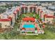 Stunning aerial view showcases the community's pool, landscaping, and building design at 21405 Olean Blvd # 224, Port Charlotte, FL 33952