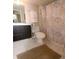 Bathroom with a modern vanity, toilet, and a shower with a decorative curtain at 21405 Olean Blvd # 224, Port Charlotte, FL 33952