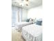 Bright bedroom with two twin beds, floral bedding, and natural light from sliding glass doors at 21405 Olean Blvd # 224, Port Charlotte, FL 33952