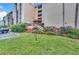 Close up exterior shot of a condominium building with landscaped grounds and convenient parking at 21405 Olean Blvd # 224, Port Charlotte, FL 33952