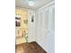 Hallway leading to a bathroom, with a view of the sink, and a large closet at 21405 Olean Blvd # 224, Port Charlotte, FL 33952