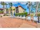 Relaxing poolside chairs provide a tranquil setting to enjoy the sun and tropical surroundings at 21405 Olean Blvd # 224, Port Charlotte, FL 33952