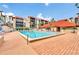 Sparkling pool provides a refreshing oasis, surrounded by lounge chairs for relaxation at 21405 Olean Blvd # 224, Port Charlotte, FL 33952